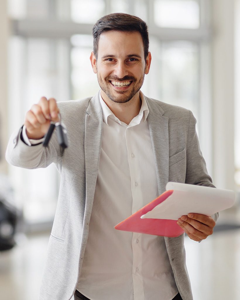 salesperson-workin-at-car-dealership-RCG2WQP.jpg